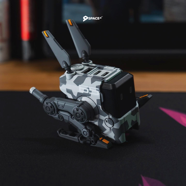 The Gravastar Alpha65 multi-port charger with GaN technology, featuring a compact sci-fi design